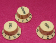 Load image into Gallery viewer, Original Fender Aged Cream Knobs with Green Font for Fender® Stratocaster
