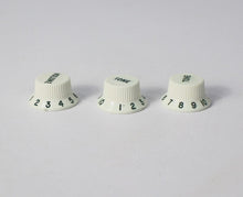 Load image into Gallery viewer, Original Fender NOS Parchment Knobs with Green Font for Fender® Stratocaster
