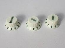 Load image into Gallery viewer, Original Fender NOS Parchment Knobs with Green Font for Fender® Stratocaster
