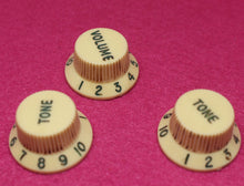 Load image into Gallery viewer, Original Fender Aged Cream Knobs with Green Font for Fender® Stratocaster
