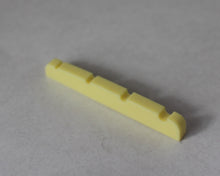 Load image into Gallery viewer, Bass Guitar Nut Plastic Graphite Compound For P Bass 43 mm x 3.5mm Ivory 3 Pcs
