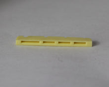 Load image into Gallery viewer, Bass Guitar Nut Plastic Graphite Compound For P Bass 43 mm x 3.5mm Ivory 3 Pcs

